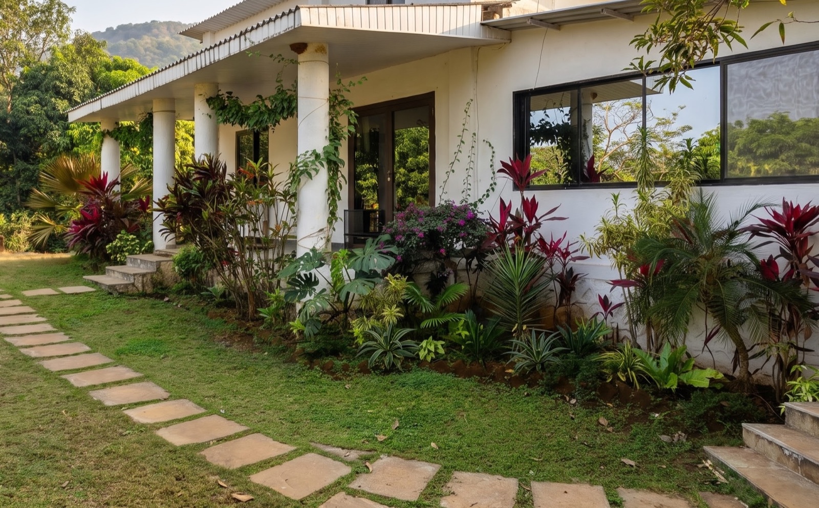 Bougan'Villa surrounded by flowers and greenery